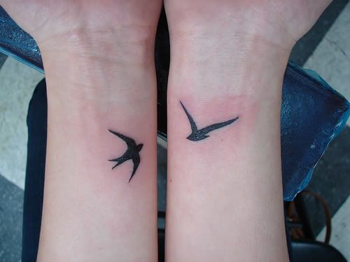 i love wrist tattoos. and i love word tattoos, or neat symbols and shapes.
